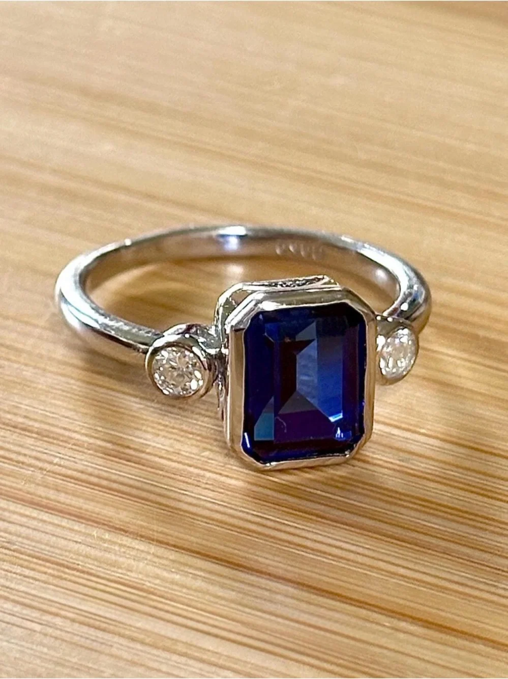 A certified 3ct lab-grown blue sapphire & .20ctw Moissanite ring, in 925 or 935!